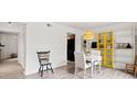 Bright dining area with round table, shelving, and hardwood floors at 1115 Scaleybark Rd # D, Charlotte, NC 28209