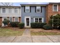 Townhome exterior with gray and brick facade at 1115 Scaleybark Rd # D, Charlotte, NC 28209