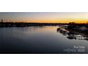 Scenic sunset view over the lake and houses at 117 Biscayne Ct, Mooresville, NC 28117