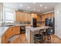 Spacious kitchen featuring light wood cabinets, a corner sink, and double ovens at 117 Biscayne Ct, Mooresville, NC 28117