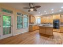 Spacious kitchen with wood cabinets, island, and stainless steel appliances at 117 Biscayne Ct, Mooresville, NC 28117