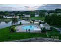 Aerial view of community pool and surrounding houses on the lake at 117 Biscayne Ct, Mooresville, NC 28117