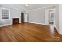 Bright living room with hardwood floors and a brick fireplace at 1215 Neal Hawkins Rd, Gastonia, NC 28056