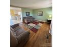 Spacious living room featuring hardwood floors and a view of the kitchen at 1217 Burke Rd, Shelby, NC 28152