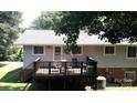 Home features a deck overlooking a wooded area at 1309 Poplar Cir, Newton, NC 28658