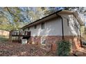 Rear view of house showing deck and partial brick foundation at 1309 Poplar Cir, Newton, NC 28658