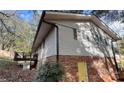 Side view of house showing deck and partial brick foundation at 1309 Poplar Cir, Newton, NC 28658