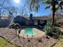 Inviting kidney-shaped pool with brick patio and lush landscaping at 1432 Jules Ct, Charlotte, NC 28226