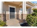 Inviting front entrance with stone pillars and a dark door at 1527 Sunflower Field Pl, Matthews, NC 28104