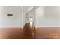 Hardwood floor living room with an open floor plan at 1527 Sunflower Field Pl, Matthews, NC 28104