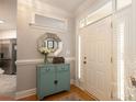 Bright entryway with teal cabinet and large mirror at 1575 Herlong Ct, Rock Hill, SC 29732