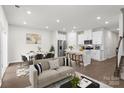 Spacious living room with an open floor plan and neutral colors at 1608 Village Grove Ln, Monroe, NC 28110