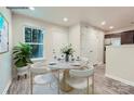 Bright dining area with round table, four chairs, and large window at 1750 J Julian Ln, Charlotte, NC 28208