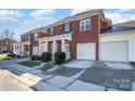 Townhome with two-car garage and manicured landscaping at 20215 Middletown Rd, Cornelius, NC 28031