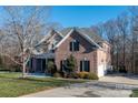 Two-story brick home with attached garage and landscaping at 205 Micah Ln # 33, Iron Station, NC 28080