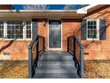 Charming front entrance with brick stairs and a dark gray door at 2221 Franklin St, Rock Hill, SC 29732