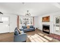 Sunlit living room featuring hardwood floors and fireplace at 2221 Franklin St, Rock Hill, SC 29732