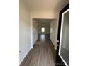 Bright entryway with wood-look flooring leading to the living room at 2255 Transatlantic Ave, Charlotte, NC 28215