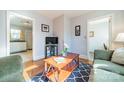 Living room with couches, coffee table, and kitchen view at 2516 Columbus Cir, Charlotte, NC 28208