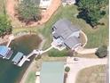 Aerial view of waterfront home with private dock and boat lift at 2579 Ranger Island Rd, Denver, NC 28037