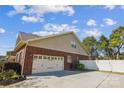 Two car garage with brick exterior and white doors at 2943 Tallgrass Blf, Rock Hill, SC 29732