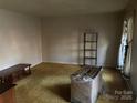 Spacious living room with wood-toned furniture at 3326 Winterfield Pl, Charlotte, NC 28205