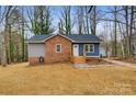 Charming renovated ranch home with brick and blue siding at 3711 Indian Ct, Lenoir, NC 28601