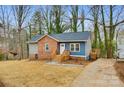 Brick and blue ranch house with updated landscaping and driveway at 3711 Indian Ct, Lenoir, NC 28601