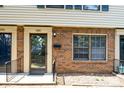 Brick townhouse with front door, windows, and small porch at 4762 Old Lantern Way, Charlotte, NC 28212