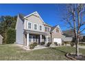 Two-story home with attractive landscaping and stone accents at 5030 Monacan Way, Indian Land, SC 29707