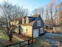 Gray house with white garage and fenced yard at 5229 Mt Holly Huntersville Rd, Charlotte, NC 28216