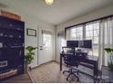 Functional home office with large window, desk, and ample natural light at 5229 Mt Holly Huntersville Rd, Charlotte, NC 28216