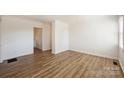 Light-filled living room with hardwood floors and neutral walls at 533 Wakefield Dr # B, Charlotte, NC 28209