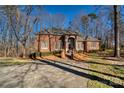 Spacious brick home with a large yard and mature trees at 5424 Amanda Ln, Belmont, NC 28012