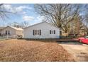 Rear of house with spacious backyard and parking area at 6208 Karenstone Dr, Charlotte, NC 28215