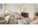 Spacious living room featuring a wood coffee table and neutral decor at 6633 Old Reid Rd, Charlotte, NC 28210