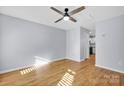 Light gray walls, hardwood floors, and a ceiling fan at 9150 Austin Ridge Ln, Charlotte, NC 28214