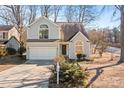 Two-story house with gray siding, a white garage door, and landscaping at 9600 Kayce Ln, Charlotte, NC 28213