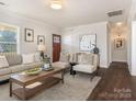 Spacious living room featuring hardwood floors and stylish furniture at 1317 Downs Ave, Charlotte, NC 28205