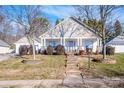 Two-story house with stone accents and a front porch at 148 Tarrington Dr, Statesville, NC 28625