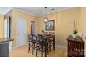 Small dining area with four chairs and hardwood flooring at 1733-C Matheson Ave, Charlotte, NC 28205