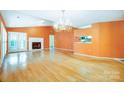 Living room with hardwood floors, fireplace and chandelier at 1749 Ridgefield Ct, Rock Hill, SC 29732