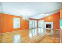 Spacious living room with hardwood floors, fireplace, and a chandelier at 1749 Ridgefield Ct, Rock Hill, SC 29732