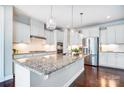 Modern kitchen featuring a large island, stainless steel appliances, and beautiful pendant lighting at 2214 Brandybuck Ct, Fort Mill, SC 29715