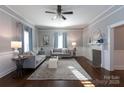 Bright and airy living room with hardwood floors and neutral decor at 298 Misenheimer Nw Dr, Concord, NC 28025