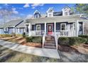 Blue house with white porch and brick steps at 3416 Red Fox Trl, Matthews, NC 28104