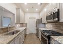 Modern kitchen with granite countertops and stainless steel appliances at 5601 Fairview Rd # 22, Charlotte, NC 28209