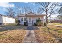 House exterior showcasing gray siding, front porch, and landscaped yard at 611 Clarinda St, Rock Hill, SC 29730