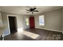 Living room featuring hardwood floors and a red front door at 830 Richard Ave, Kannapolis, NC 28081