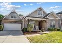 Charming brick home with a welcoming front porch and landscaping at 8512 Willow Branch Dr, Waxhaw, NC 28173